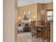Cozy dining area open to the living room features views of an art display and a comfortable sofa at 6202 E Mckellips Rd # 189, Mesa, AZ 85215