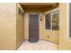 View of the front entry door, which features a dark security door, sidelight windows, brick pavers, and a neutral stucco exterior at 6202 E Mckellips Rd # 189, Mesa, AZ 85215