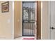View of the entryway door showing the security screen and view into the front courtyard with pergola at 6202 E Mckellips Rd # 189, Mesa, AZ 85215