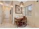 Hallway with a home office nook featuring a window, desk, and natural lighting at 6202 E Mckellips Rd # 189, Mesa, AZ 85215