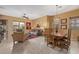 Open living room and dining room combo with views to the outdoor patio at 6202 E Mckellips Rd # 189, Mesa, AZ 85215