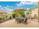 Picturesque outdoor dining area with elegant seating, lush landscaping, and sunny blue sky at 6202 E Mckellips Rd # 189, Mesa, AZ 85215