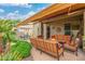 Inviting backyard featuring a covered patio with comfortable seating, a dining area, and well-maintained landscaping at 6202 E Mckellips Rd # 189, Mesa, AZ 85215