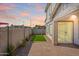 Private back yard with brick pavers, artificial turf and block wall at 630 W Laredo St, Chandler, AZ 85225