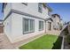 A well-kept backyard with synthetic grass and a covered patio area at 630 W Laredo St, Chandler, AZ 85225