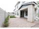 Spacious backyard featuring a patio, pavers, artificial turf, and privacy walls at 630 W Laredo St, Chandler, AZ 85225