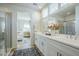 Bright bathroom features a double sink vanity and a glass-enclosed shower, with views into an adjacent bedroom at 630 W Laredo St, Chandler, AZ 85225