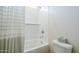 Clean and white bathroom with a shower and tub, and a white toilet, offering a refreshing space at 630 W Laredo St, Chandler, AZ 85225