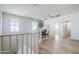 Bright hallway features wood-look floors, white railings, and a ceiling fan at 630 W Laredo St, Chandler, AZ 85225