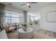 Open concept living room flows into dining area and kitchen with lots of light and modern decor at 630 W Laredo St, Chandler, AZ 85225
