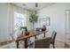 Bright home office with wood-look floors, large windows, and a decorative tree at 630 W Laredo St, Chandler, AZ 85225