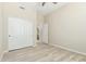 Bedroom featuring hardwood floors, ceiling fan, closet, and en-suite bathroom at 6528 W Via Montoya Dr, Glendale, AZ 85310