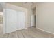 Bedroom showcasing wood-look floors, a ceiling fan, and access to another room at 6528 W Via Montoya Dr, Glendale, AZ 85310