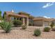 Well-maintained front yard with desert landscaping and beautiful curb appeal at 6528 W Via Montoya Dr, Glendale, AZ 85310