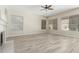 Spacious living room with large windows providing ample natural light and wood flooring at 6528 W Via Montoya Dr, Glendale, AZ 85310