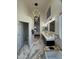 Spacious bathroom featuring dual vanity, modern lighting, and marble floors at 6821 W Donald Dr, Glendale, AZ 85310