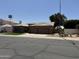 Attractive single-story home with a tile roof, an attached three-car garage, and well-kept landscaping at 6821 W Donald Dr, Glendale, AZ 85310