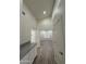 Hallway view featuring wood-style flooring, a built-in counter, and neutral walls at 6821 W Donald Dr, Glendale, AZ 85310