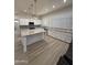 Bright kitchen featuring a large island, modern appliances, and custom cabinetry at 6821 W Donald Dr, Glendale, AZ 85310