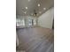 Bright living room with shuttered windows, ceiling fan, and tile flooring at 6821 W Donald Dr, Glendale, AZ 85310
