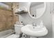 Bathroom boasts tile flooring, tiled shower, and round mirror at 7229 S Butte Ave, Tempe, AZ 85283