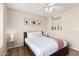 Neutral bedroom with king bed, bedside tables, and golf clubs on the wall at 7229 S Butte Ave, Tempe, AZ 85283