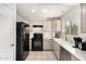 Well-maintained kitchen with ample counter space, stainless steel dishwasher, and modern appliances at 7229 S Butte Ave, Tempe, AZ 85283