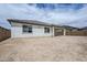 Spacious backyard featuring a covered patio and privacy fence at 7531 W Odeum Ln, Phoenix, AZ 85043