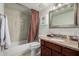 This bathroom features a tub and shower combination, a vanity, and an elegant mirror at 7625 E Camelback Rd # B124, Scottsdale, AZ 85251