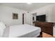 This bedroom boasts hardwood floors and a large dresser for storage at 7625 E Camelback Rd # B124, Scottsdale, AZ 85251