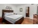 Comfortable bedroom featuring hardwood floors and an en-suite bathroom at 7625 E Camelback Rd # B124, Scottsdale, AZ 85251