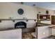 Clubhouse dining area with cozy fireplace, comfortable seating, and an open view to the kitchen at 7625 E Camelback Rd # B124, Scottsdale, AZ 85251