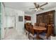 This dining room features a wooden table and hutch, complemented by tiled flooring at 7625 E Camelback Rd # B124, Scottsdale, AZ 85251