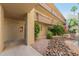 Exterior view of a condo building with well-maintained landscaping and walkways at 7625 E Camelback Rd # B124, Scottsdale, AZ 85251