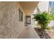 View of the exterior of the condo showing a walkway and manicured landscaping at 7625 E Camelback Rd # B124, Scottsdale, AZ 85251