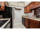 This well-lit kitchenette features modern appliances and granite countertops at 7625 E Camelback Rd # B124, Scottsdale, AZ 85251