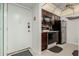 Functional kitchenette showcasing sleek appliances and easy access to the front door at 7625 E Camelback Rd # B124, Scottsdale, AZ 85251