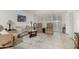 Bright living room with tile floors, neutral furniture, and stylish coffee table at 7625 E Camelback Rd # B124, Scottsdale, AZ 85251