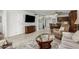 Cozy living room featuring tile flooring, TV, and dining area at 7625 E Camelback Rd # B124, Scottsdale, AZ 85251