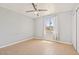 Bedroom with tile floors, a ceiling fan, a window and closet for plenty of storage at 7720 W Indianola Ave, Phoenix, AZ 85033