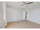 Neutral bedroom featuring tile floors, closet and access to additional rooms at 7720 W Indianola Ave, Phoenix, AZ 85033