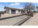 Charming single-story home with a well-maintained front yard and a convenient attached garage at 7720 W Indianola Ave, Phoenix, AZ 85033