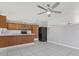 Functional kitchen with a breakfast bar and ample cabinet storage at 7720 W Indianola Ave, Phoenix, AZ 85033