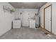 Practical laundry room with washer, dryer, and extra storage space at 7720 W Indianola Ave, Phoenix, AZ 85033