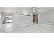 Spacious living area with contemporary tile floors and a seamless flow at 7720 W Indianola Ave, Phoenix, AZ 85033