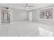 Expansive living space with sleek tile floors and plenty of natural light at 7720 W Indianola Ave, Phoenix, AZ 85033