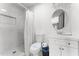 Clean bathroom features a shower with marble-patterned tile, a toilet, and a vanity with sink at 8044 N 10Th Pl, Phoenix, AZ 85020