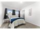 Cozy carpeted bedroom with a window for natural light and a small side table at 8044 N 10Th Pl, Phoenix, AZ 85020