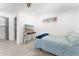 Bright bedroom showcasing a TV, closet, and bed with a blue throw at 8044 N 10Th Pl, Phoenix, AZ 85020