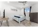 Cozy bedroom featuring a comfortable bed, ceiling fan, and a stylish area rug at 8044 N 10Th Pl, Phoenix, AZ 85020